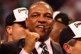 BOSTON - JUNE 17:  Head coach Doc Rivers of the Boston Celtics celebrates with a victory cigar after defeating the Los Angeles Lakers in Game Six of the 2008 NBA Finals on June 17, 2008 at TD Banknorth Garden in Boston, Massachusetts. NOTE TO USER: User expressly acknowledges and agrees that, by downloading and/or using this Photograph, user is consenting to the terms and conditions of the Getty Images License Agreement.  (Photo by Elsa/Getty Images)