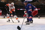 NEW YORK - FEBRUARY 18:  Blair Betts #15 of the New York Rangers defends the net against Mike Comrie #89 of the New York Islanders on February 18, 2009 at Madison Square Garden in New York City.The Rangers defeated the Islanders 3-1.  (Photo by Bruce Bennett/Getty Images)