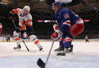 NEW YORK - FEBRUARY 18:  Blair Betts #15 of the New York Rangers defends the net against Mike Comrie #89 of the New York Islanders on February 18, 2009 at Madison Square Garden in New York City.The Rangers defeated the Islanders 3-1.  (Photo by Bruce Bennett/Getty Images)