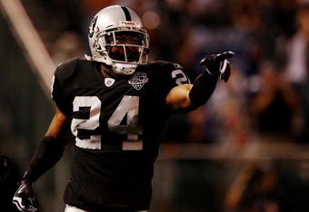 OAKLAND, CA - AUGUST 13:  Safety Michael Huff #24 of the Oakland Raiders celebrates after making an interception against the Dallas Cowboys during the preseason game at Oakland-Alameda County Coliseum on August 13, 2009 in Oakland, California. (Photo by Jed Jacobsohn/Getty Images)