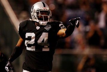 OAKLAND, CA - AUGUST 13:  Safety Michael Huff #24 of the Oakland Raiders celebrates after making an interception against the Dallas Cowboys during the preseason game at Oakland-Alameda County Coliseum on August 13, 2009 in Oakland, California. (Photo by Jed Jacobsohn/Getty Images)
