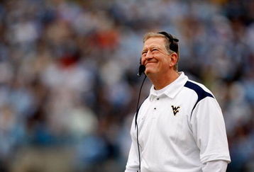 CHARLOTTE, NC - DECEMBER 27:  Head coach Bill Stewart of the West Virginia Mountaineers looks at the scoreboard during their game against the North Carolina Tar Heels at Bank of America Stadium on December 27, 2008 in Charlotte, North Carolina.  (Photo by Streeter Lecka/Getty Images)