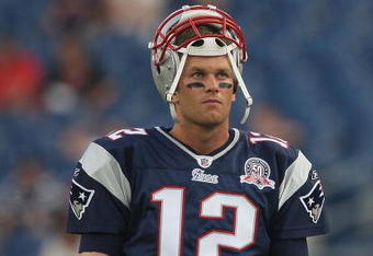 FOXBORO, MA - AUGUST 20:  Tom Brady #12 of the New England Patriots pauses before a game against the Cincinnati Bengals at Gillette Stadium on August 20, 2009 in Foxboro, Massachusetts. (Photo by Jim Rogash/Getty Images)
