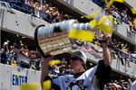 PITTSBURGH - JUNE 15:  Marc-Andre Fleury #29 of the Pittsburgh Penguins holds aloft the Stanley Cup for the crowd on the Blvd of the Allies during Stanley Cup Champion Victory Parade on June 15, 2009 in Pittsburgh, Pennsylvania.  (Photo by Jamie Sabau/Getty Images)