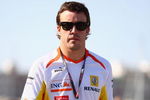 VALENCIA, SPAIN - AUGUST 22:  Fernando Alonso of Spain and Renault walks in the paddock following qualifying for the European Formula One Grand Prix at the Valencia Street Circuit on August 22, 2009, in Valencia, Spain.  (Photo by Ryan Pierse/Getty Images)