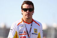 VALENCIA, SPAIN - AUGUST 22: Fernando Alonso of Spain and Renault walks in the paddock following qualifying for the European Formula One Grand Prix at the Valencia Street Circuit on August 22, 2009, in Valencia, Spain. (Photo by Ryan Pierse/Getty Images)