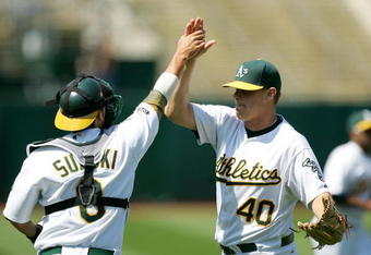 OAKLAND, CA - JUNE 07:  Kurt Suzuki #8 of the Oakland Athletics congratulates relief pitcher Andrew Bailey #40 after the Athletics beat the Baltimore Orioles at the Oakland Coliseum on June 7, 2009 in Oakland, California.  (Photo by Ezra Shaw/Getty Images)