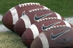 ORLANDO, FL - OCTOBER 20: Nike footballs line up for warmups as the University of Central Florida Golden Knights host the Tulsa Golden Hurricane at Bright House Stadium on October 20, 2007 in Orlando, Florida.  UCF won 44 - 23. (Photo by Al Messerschmidt/Getty Images)
