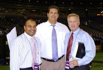 ESPN television crew is set to broadcast  the 2005 American Bowl  Aug. 6    at the Tokyo Dome  in Japan.   Mike Tirico (left), Mike Golic and Chris Mortensen (right) watched the Atlanta   Falcons defeat the Indianapolis  Colts 27 - 21.  (Photo by Al Messerschmidt/Getty Images)