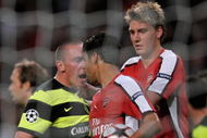 LONDON, ENGLAND - AUGUST 26:  Eduardo of Arsenal is confronted by Scott Brown of Celtic after winning a first half penalty for his team during the UEFA Champions League 2nd qualifying round 2nd leg match between Arsenal and Celtic at the Emirates Stadium on August 26, 2009 in London, England.  (Photo by Shaun Botterill/Getty Images)