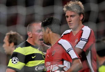 LONDON, ENGLAND - AUGUST 26:  Eduardo of Arsenal is confronted by Scott Brown of Celtic after winning a first half penalty for his team during the UEFA Champions League 2nd qualifying round 2nd leg match between Arsenal and Celtic at the Emirates Stadium on August 26, 2009 in London, England.  (Photo by Shaun Botterill/Getty Images)