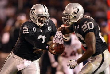 OAKLAND, CA - SEPTEMBER 8:  Quarterback JaMarcus Russell #2 of the Oakland Raiders hands off the ball to Darren McFadden #20 during the NFL game against the Denver Broncos on September 8, 2008 at McAfee Coliseum in Oakland, California. The Broncos defeated the Raiders 41-14. (Photo by Jed Jacobsohn/Getty Images)