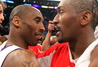 LOS ANGELES, CA - MAY 17:  Kobe Bryant #24 of the Los Angeles Lakers hugs Ron Artest #96 of the Houston Rockets after the Lakers defeated the Rockets 89-70 in Game Seven of the Western Conference Semifinals during the 2009 NBA Playoffs at Staples Center on May 17, 2009 in Los Angeles, California. NOTE TO USER: User expressly acknowledges and agrees that, by downloading and or using this photograph, User is consenting to the terms and conditions of the Getty Images License Agreement.  (Photo by Stephen Dunn/Getty Images)
