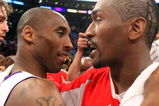 LOS ANGELES, CA - MAY 17:  Kobe Bryant #24 of the Los Angeles Lakers hugs Ron Artest #96 of the Houston Rockets after the Lakers defeated the Rockets 89-70 in Game Seven of the Western Conference Semifinals during the 2009 NBA Playoffs at Staples Center on May 17, 2009 in Los Angeles, California. NOTE TO USER: User expressly acknowledges and agrees that, by downloading and or using this photograph, User is consenting to the terms and conditions of the Getty Images License Agreement.  (Photo by Stephen Dunn/Getty Images)