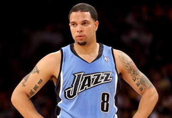 LOS ANGELES, CA - MAY 14:  Deron Williams #8 of the Utah Jazz looks across the court in Game Five of the Western Conference Semifinals against the Los Angeles Lakers during the 2008 NBA Playoffs on May 14, 2008 at Staples Center in Los Angeles, California.  NOTE TO USER: User expressly acknowledges and agrees that, by downloading and/or using this Photograph, user is consenting to the terms and conditions of the Getty Images License Agreement.  (Photo by Stephen Dunn/Getty Images)