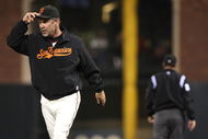 SAN FRANCISCO - AUGUST 10: Manager Bruce Bochy of the San Francisco Giants is thrown out of the game by umpire Bill Hohn for arguing a play in the fifth inning against the Los Angeles Dodgers during a Major League Baseball game at AT&T Park on August 10, 2009 in San Francisco, California. (Photo by Jed Jacobsohn/Getty Images)