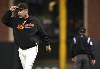 SAN FRANCISCO - AUGUST 10: Manager Bruce Bochy of the San Francisco Giants is thrown out of the game by umpire Bill Hohn for arguing a play in the fifth inning against the Los Angeles Dodgers during a Major League Baseball game at AT&T Park on August 10, 2009 in San Francisco, California. (Photo by Jed Jacobsohn/Getty Images)