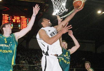 WELLINGTON, NEW ZEALAND - AUGUST 25:  Mika Vucona of the Tall Blacks jumps for a shot with Andrew Ogilvy and Brad Newley of the Boomers in defense during game two of the Ramsey Shield series between the Australian Boomers and the New Zealand Tall Blacks at TSB Bank Arena on August 25, 2009 in Wellington, New Zealand.  (Photo by Marty Melville/Getty Images)