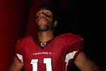 GLENDALE, AZ - AUGUST 22:  Wide receiver Larry Fitzgerald #11 of the Arizona Cardinals waits for introductions prior to the preseason NFL game against the San Diego Chargers at the Universtity of Phoenix Stadium on August 22, 2009 in Glendale, Arizona. The Chargers defeated the Cardinals 17-6.  (Photo by Christian Petersen/Getty Images)