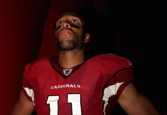 GLENDALE, AZ - AUGUST 22:  Wide receiver Larry Fitzgerald #11 of the Arizona Cardinals waits for introductions prior to the preseason NFL game against the San Diego Chargers at the Universtity of Phoenix Stadium on August 22, 2009 in Glendale, Arizona. The Chargers defeated the Cardinals 17-6.  (Photo by Christian Petersen/Getty Images)