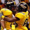 NEW ORLEANS - DECEMBER 21:  Damion Fletcher #25 and Gerald Baptiste #86 of the Southern Mississippi Golden Eagles celebrate after Baptiste scored on a 64 yard pass against the Troy Trojans on during the R+L Carriers New Orleans Bowl on December 21, 2008 at the Superdome in New Orleans, Louisiana.  (Photo by Chris Graythen/Getty Images)