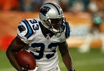 MIAMI - AUGUST 22:  Running back Mike Goodson #33 of the Carolina Panthers looks for room to run against the Miami Dolphins during a pre-season game at Land Shark Stadium on August 22, 2009 in Miami, Florida. The Dolphins defeated the Panthers 27-17.  (Photo by Doug Benc/Getty Images)
