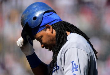 DENVER - AUGUST 27:  Manny Ramirez #99 of the Los Angeles Dodgers heads back to the dugout after lining out to pitcher Jorge De La Rosa in the first inning against the Colorado Rockies at Coors Field on August 27, 2009 in Denver, Colorado.  (Photo by Doug Pensinger/Getty Images)