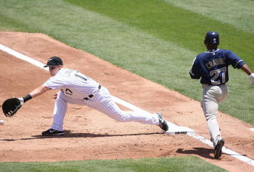 MIAMI - MAY 04: First baseman Mike Jacobs #17 of the Florida Marlins bats cannot make the play against Crabbe #27 of the San Diego Padres at Dolphin Stadium on May 4, 2008 in Miami, Florida. The Marlins defeated the Padres 10-3.  (Photo by Marc Serota/Getty Images)