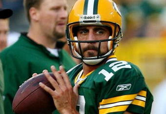 GREEN BAY, WI - AUGUST 15:  Quarterback Aaron Rodgers #12 of the Green Bay Packers warms up before taking on the Cleveland Browns during the preseason game at Lambeau Field on August 15, 2009 in Green Bay, Wisconsin.  (Photo by Jonathan Daniel/Getty Images)