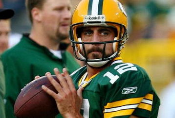 GREEN BAY, WI - AUGUST 15:  Quarterback Aaron Rodgers #12 of the Green Bay Packers warms up before taking on the Cleveland Browns during the preseason game at Lambeau Field on August 15, 2009 in Green Bay, Wisconsin.  (Photo by Jonathan Daniel/Getty Images)