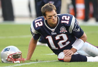 PHILADELPHIA - AUGUST 13:  Quarterback Tom Brady #12 of the New England Patriots looks on during warmups before the preseason game against the Philadelphia Eagles on August 13, 2009 at Lincoln Financial Field in Philadelphia, Pennsylvania. (Photo by Jim McIsaac/Getty Images)