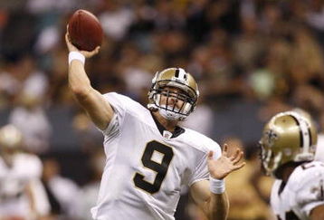 NEW ORLEANS - AUGUST 14:  Quarterback Drew Brees #9 of the New Orleans Saints throws a touchdown pass to tight end Jeremy Shockey (not pictured) during a preseason game against the Cincinnati Bengals on August 14, 2009 at the Superdome in New Orleans, Louisiana. (Photo by Chris Graythen/Getty Images)