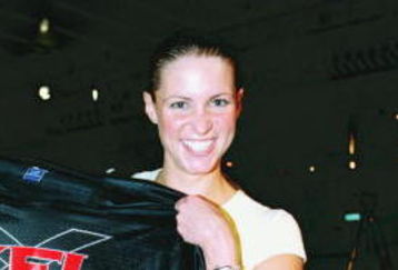 12 Jul 2000: Stephanie McMahon poses with a XFL jersey during the XFL Press Conference at the House of Blues in Los Angeles, California.Mandatory Credit: Tom Hauck  /Allsport