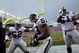 DENVER - SEPTEMBER 16:  Thomas Howard #53 of the Oakland Raiders celebrates his interception for a touchdown with Kirk Morrison #52 and Gerard Warren #61 against the Denver Broncos as the Broncos defeated the Raiders 23-20 in overtime during week two NFL action at Invesco Field at Mile High on September 16, 2007 in Denver, Colorado.  (Photo by Doug Pensinger/Getty Images)