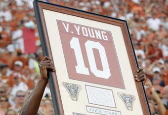 AUSTIN, TX - AUGUST 30:  Quarterback Vince Young of the Tennessee Titans, holds up his Texas Longhorns jersey as his number is retired before a game against the Florida Atlantic Owls at Darrell K Royal-Texas Memorial Stadium on August 30, 2007 in Austin, Texas.  (Photo by Brian Bahr/Getty Images)