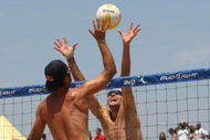 MANHATTAN BEACH, CA - JULY 18: Todd Rogers trys to hit a shot palst the block of Matt Fuerbringer at the AVP Crocs Manhattan Beach Open on July 18, 2009 in Manhattan Beach, California. Phil Dalhausser/Todd Rogers  defeated Matt Fuerbringer/Casey Jennings 21-23, 21-18, (Photo by Stephen Dunn/Getty Images)