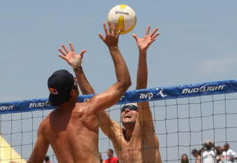 MANHATTAN BEACH, CA - JULY 18: Todd Rogers trys to hit a shot palst the block of Matt Fuerbringer at the AVP Crocs Manhattan Beach Open on July 18, 2009 in Manhattan Beach, California. Phil Dalhausser/Todd Rogers  defeated Matt Fuerbringer/Casey Jennings 21-23, 21-18, (Photo by Stephen Dunn/Getty Images)