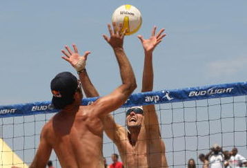MANHATTAN BEACH, CA - JULY 18: Todd Rogers trys to hit a shot palst the block of Matt Fuerbringer at the AVP Crocs Manhattan Beach Open on July 18, 2009 in Manhattan Beach, California. Phil Dalhausser/Todd Rogers  defeated Matt Fuerbringer/Casey Jennings 21-23, 21-18, (Photo by Stephen Dunn/Getty Images)