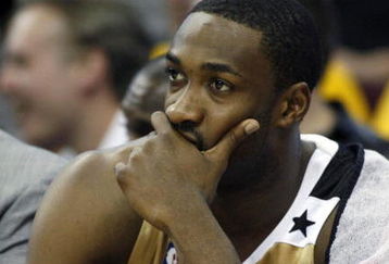 CLEVELAND - APRIL 21:  Gilbert Arenas #0 of the Washington Wizards looks on from the bench late in the game while playing the Cleveland Cavaliers in Game Two of the Eastern Conference Quarterfinals during the 2008 NBA Playoffs at Quicken Loans Arena April 21, 2008 in Cleveland, Ohio. Cleveland won the game 116-86. NOTE TO USER: User expressly acknowledges and agrees that, by downloading and or using this photograph, User is consenting to the terms and conditions of the Getty Images License Agreement.  (Photo by Gregory Shamus/Getty Images)