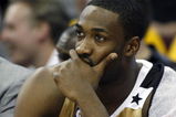CLEVELAND - APRIL 21:  Gilbert Arenas #0 of the Washington Wizards looks on from the bench late in the game while playing the Cleveland Cavaliers in Game Two of the Eastern Conference Quarterfinals during the 2008 NBA Playoffs at Quicken Loans Arena April 21, 2008 in Cleveland, Ohio. Cleveland won the game 116-86. NOTE TO USER: User expressly acknowledges and agrees that, by downloading and or using this photograph, User is consenting to the terms and conditions of the Getty Images License Agreement.  (Photo by Gregory Shamus/Getty Images)