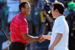 CHASKA, MN - AUGUST 16:  Y.E. Yang of South Korea (R) shakes hands with Tiger Woods on the 18th green after his three-stroke victory during the final round of the 91st PGA Championship at Hazeltine National Golf Club on August 16, 2009 in Chaska, Minnesota.  (Photo by Stuart Franklin/Getty Images)