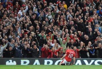 MANCHESTER, UNITED KINGDOM - AUGUST 29:   Wayne Rooney of Manchester United celebrates scoring his team's first goal during the Barclays Premier League match between Manchester United and Arsenal at Old Trafford on August 29, 2009 in Manchester, England. (Photo by Laurence Griffiths/Getty Images)