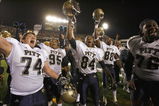 MORGANTOWN, WV - DECEMBER 1: John Malecki #74, Mick Williams #95, Maurice Williams #84 and Jeff Otah #76 of the Pittsburgh Panthers celebrates after the game against the West Virginia Mountaineers at Milan Puskar Stadium on December 1, 2007 in Morgantown, West Virginia. Pittsburgh defeated West Virginia 13-9. (Photo by Kevin C. Cox/Getty Images)