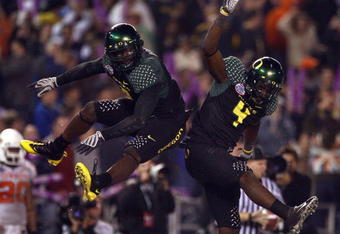 SAN DIEGO, CA - DECEMBER 30:   Runningback LeGarrette Blount #9 of the University of Oregon Ducks celebrates his touchdown with teammate Jaison Williams #4 during his team's 42-31 win over the Oklahoma State University Cowboys in the Pacific Life Holiday Bowl at Qualcomm Stadium on December 30, 2008 in San Diego, California. (Photo by Donald Miralle/Getty Images)
