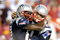 LANDOVER, MD - AUGUST 28:  Tom Brady #12 and Randy Moss #81 of the New England Patriots celebrate after scoring a touchdown in the second quarter of a preseason game against the Washington Redskins at FedExField on August 28, 2009 in Landover, Maryland.  (Photo by Greg Fiume/Getty Images)