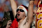 LOS ANGELES - DECEMBER 1:  Fans of the USC Trojans cheer during the college football game against the UCLA Bruins at the Los Angeles Memorial Coliseum December 1, 2007 in Los Angeles, California.  (Photo by Jeff Gross/Getty Images)