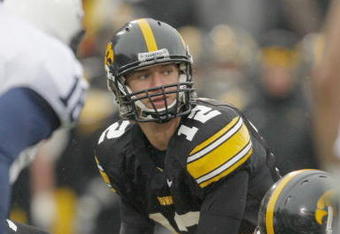IOWA CITY, IOWA - NOVEMBER 8: Quarterback Ricky Stanzi #12 of the Iowa Hawkeyes calls a play at the line during the second quarter of play against the Penn State Nittany Lions at Kinnick Stadium on November 8, 2008 in Iowa City, Iowa. Iowa defeated Penn State  24-23. (Photo by David Purdy/Getty Images)