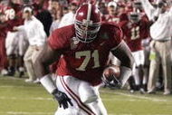 SHREVEPORT, LA - DECEMBER 28:  Andre Smith #71 of Alabama runs in for a touchdown against Oklahoma State on December 28, 2006 during the PetroSun Independence Bowl at Independence Stadium in Shreveport, Louisiana.  Oklahoma State defeated Alabama 34-31.  (Photo by Chris Graythen/Getty Images)