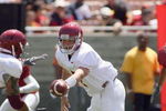 LOS ANGELES, CA - APRIL 25: Quarterback Matt Barkley #7 of the USC Trojans hands off the ball during the spring game on April 25, 2009 at the Los Angeles Memorial Coliseum in Los Angeles, California.  The cardinal team won 16-10.  (Photo by Jeff Golden/Getty Images)