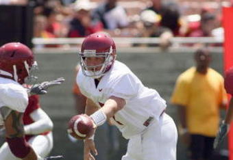 LOS ANGELES, CA - APRIL 25: Quarterback Matt Barkley #7 of the USC Trojans hands off the ball during the spring game on April 25, 2009 at the Los Angeles Memorial Coliseum in Los Angeles, California.  The cardinal team won 16-10.  (Photo by Jeff Golden/Getty Images)